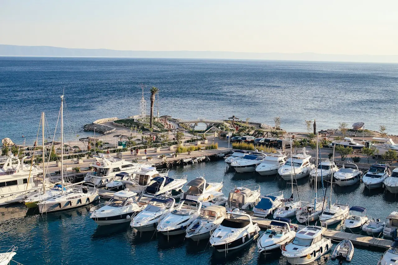 White yacht docked at the marina