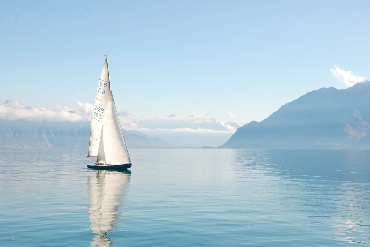 Sail boat travelling on the sea